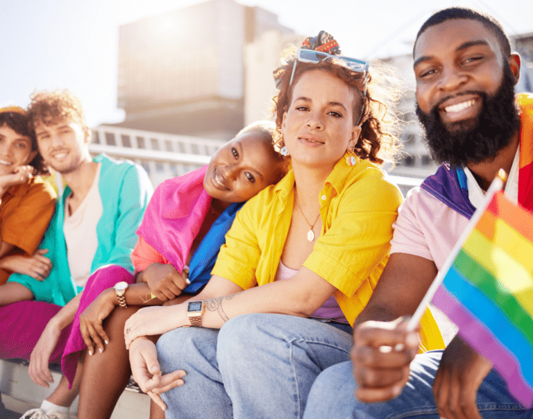 Diverse group of young people with LGBTQ+ flags