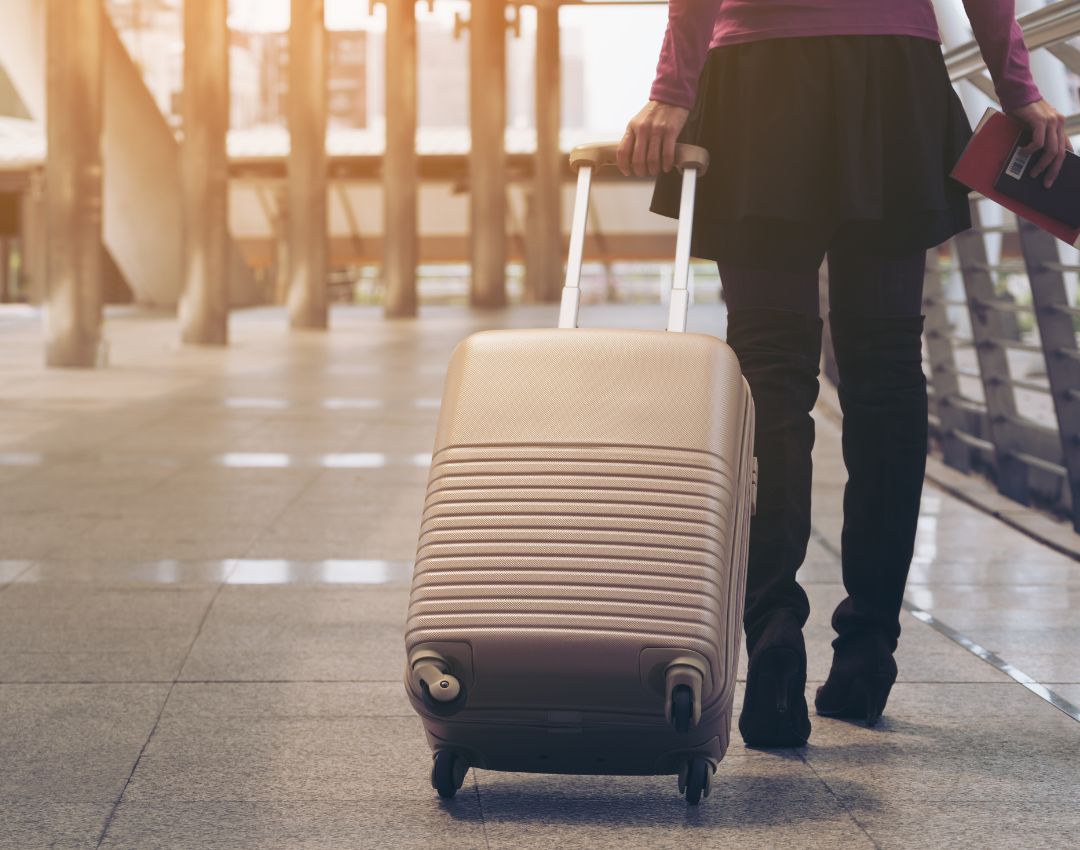 Business traveller pulling a suitcase