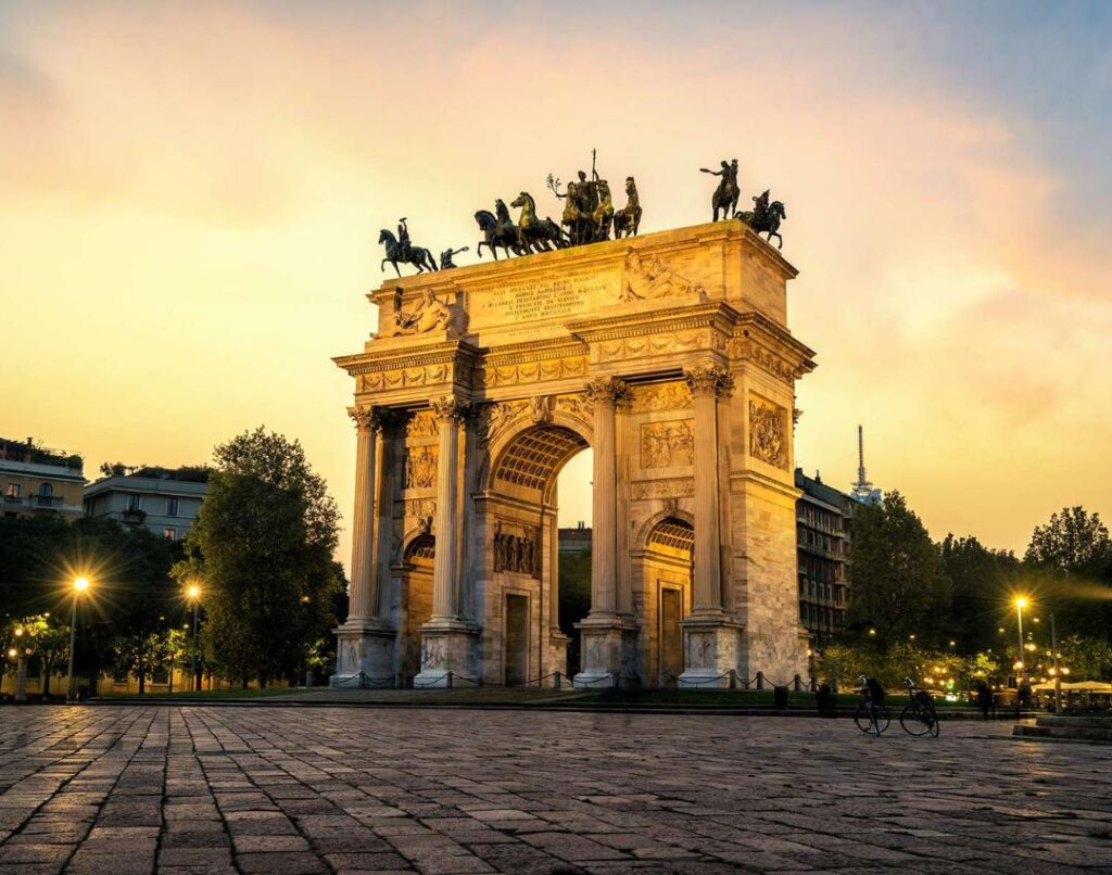 Porta Sempione in Milan with a sunset in the background