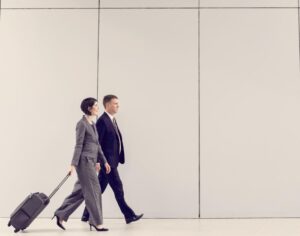 Business travellers walking through an airport