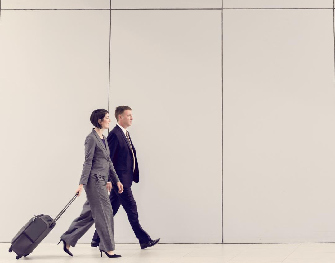 Business travellers walking through an airport